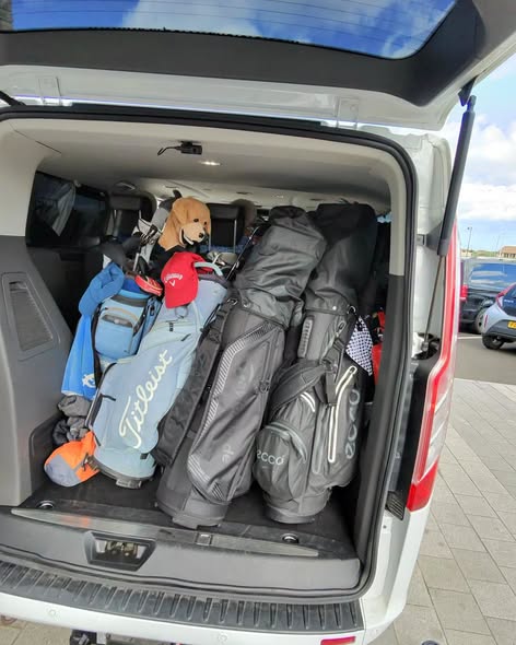Open boot of NI Airport Transfers vehicle loaded with golf clubs for a Northern Ireland golf group transfer
